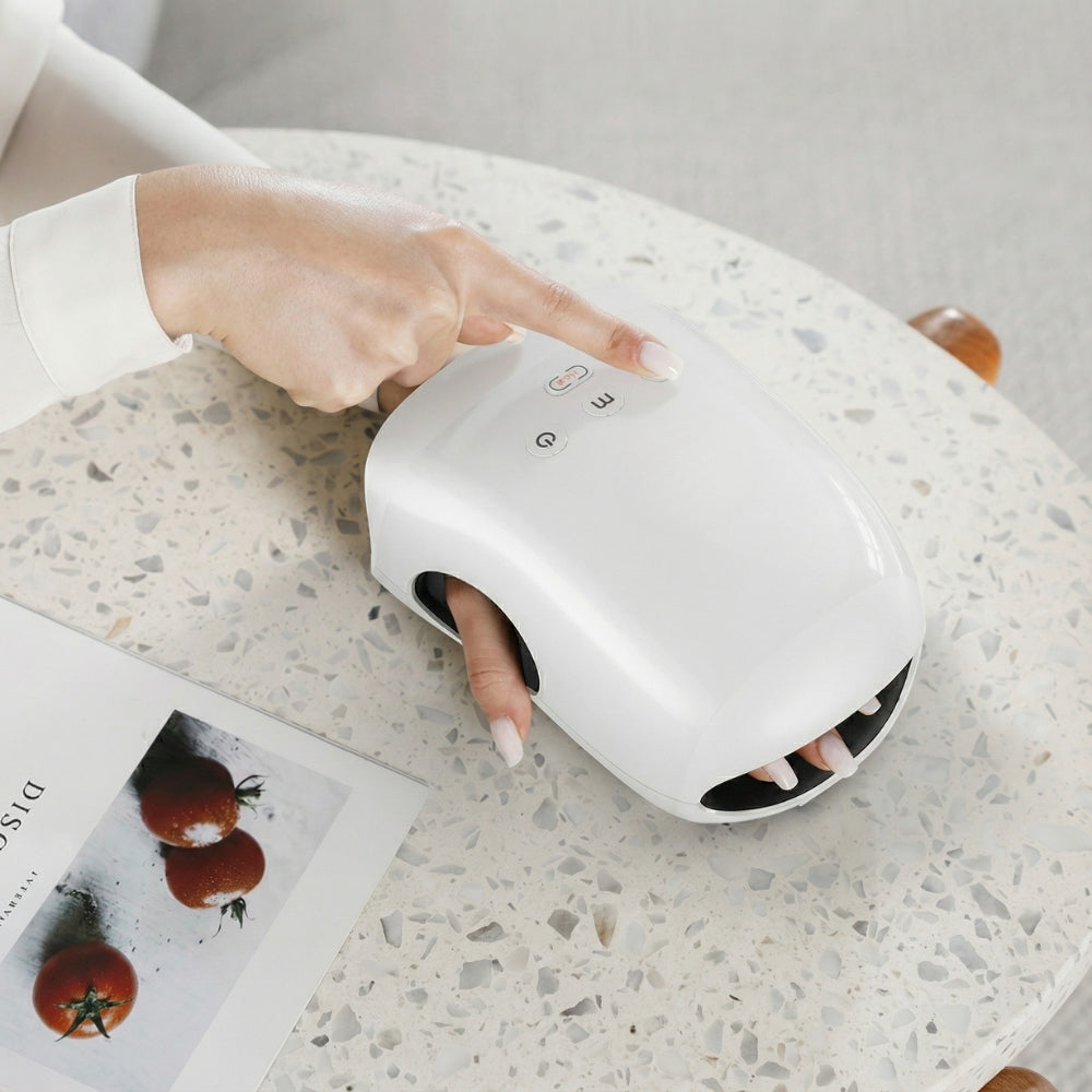 Ledningsfri håndmassager med varme og kompression til gigt og karpaltunnelsyndrom